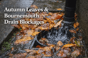 Blocked outdoor drain in Bournemouth filled with wet autumn leaves causing surface water overflow and drainage blockage