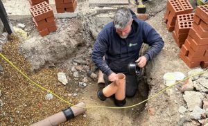Drain repair work in Winton showing inspection of damaged underground pipework at a residential property